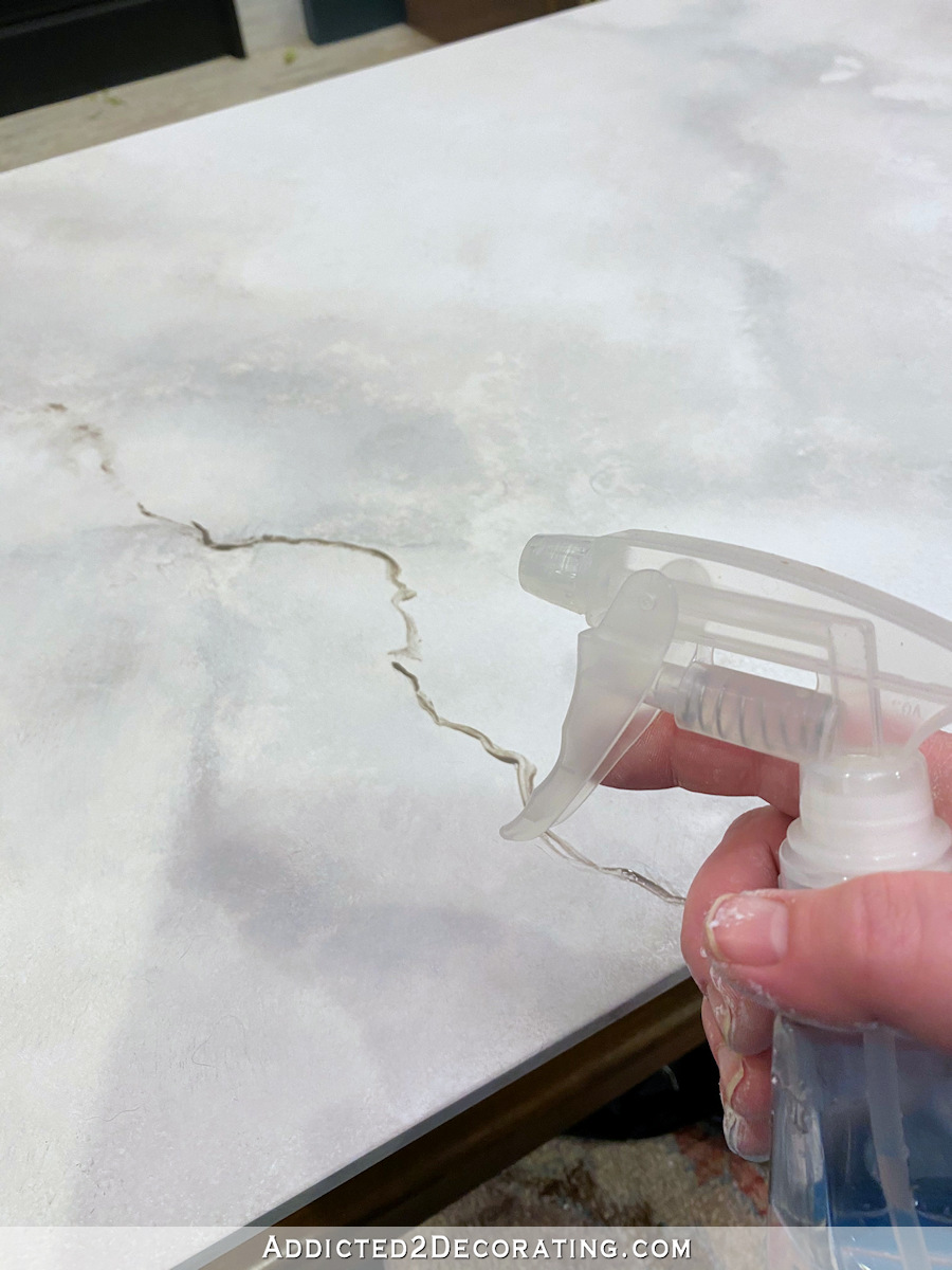 diy faux marble coffee table - 20 - spray water on small vein to soften