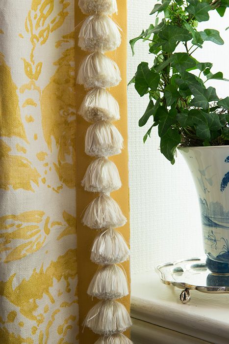 drapery panel with tassel trim on contrast band leading edge